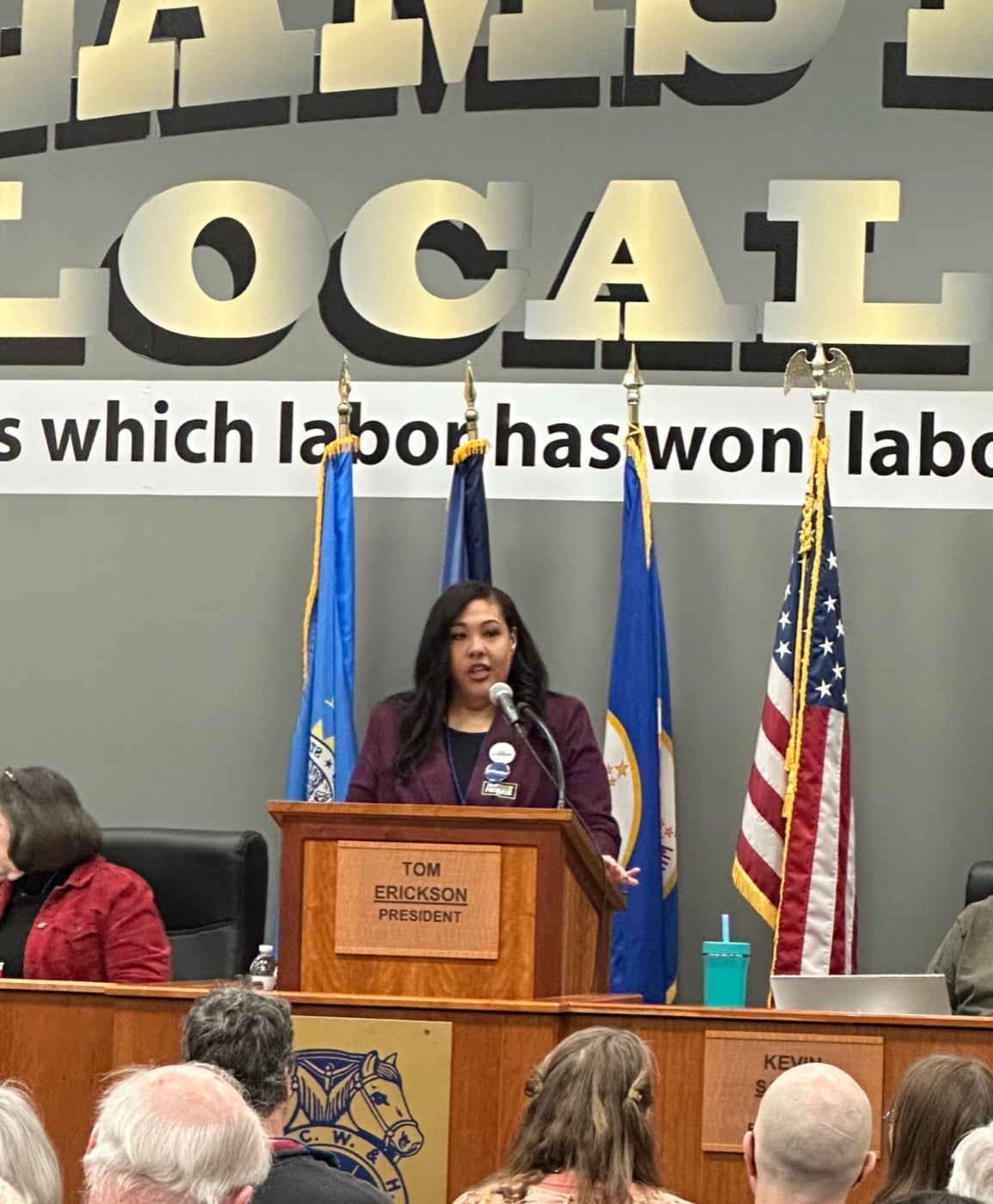 Amanda Matchett speaking at a podium during a Minnesota labor union event